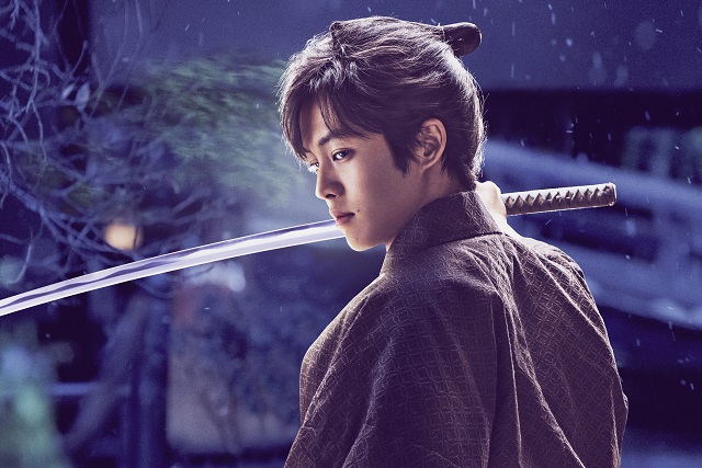 man standing with sword