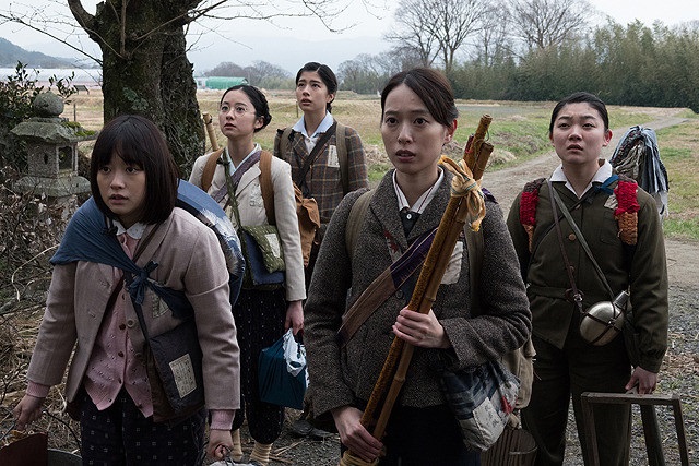 woman with children walking