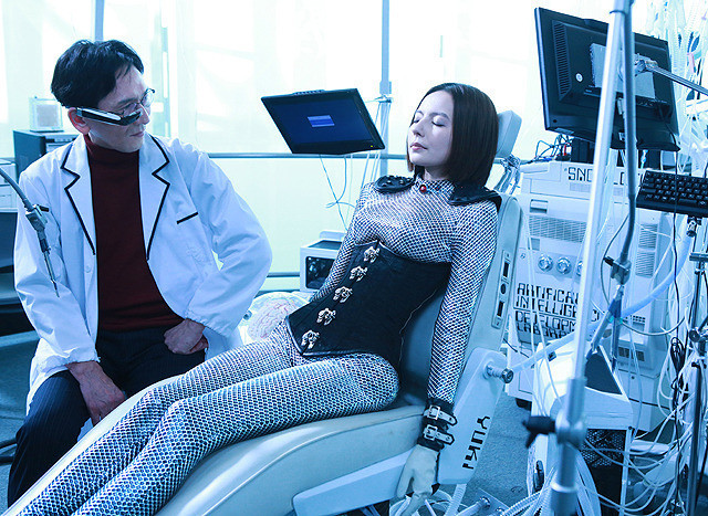 man and woman talking, woman in chair