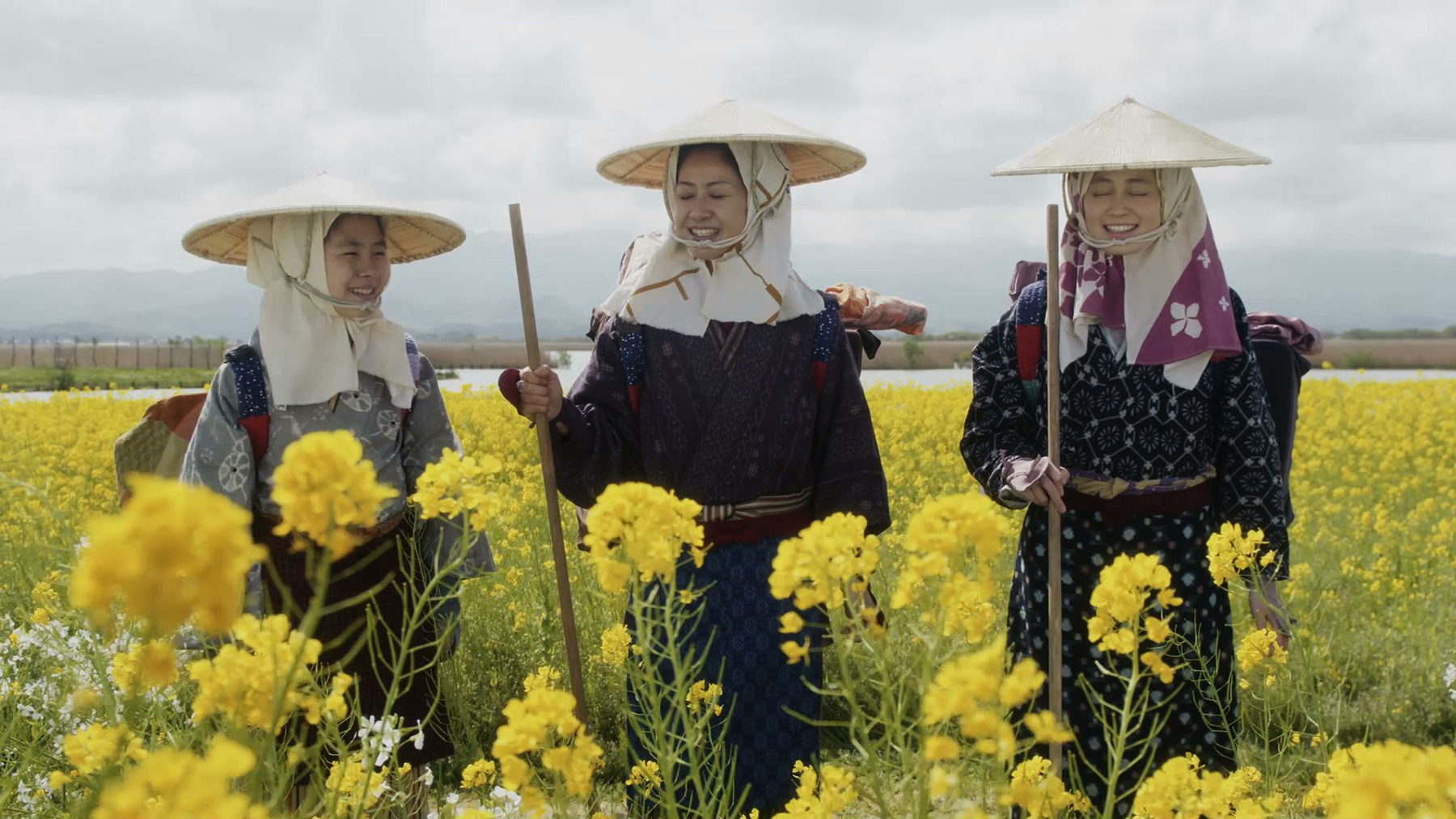 group of people in field of flowers