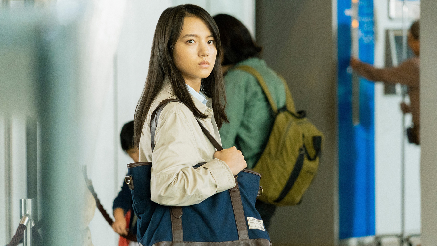 a girl holding a purse