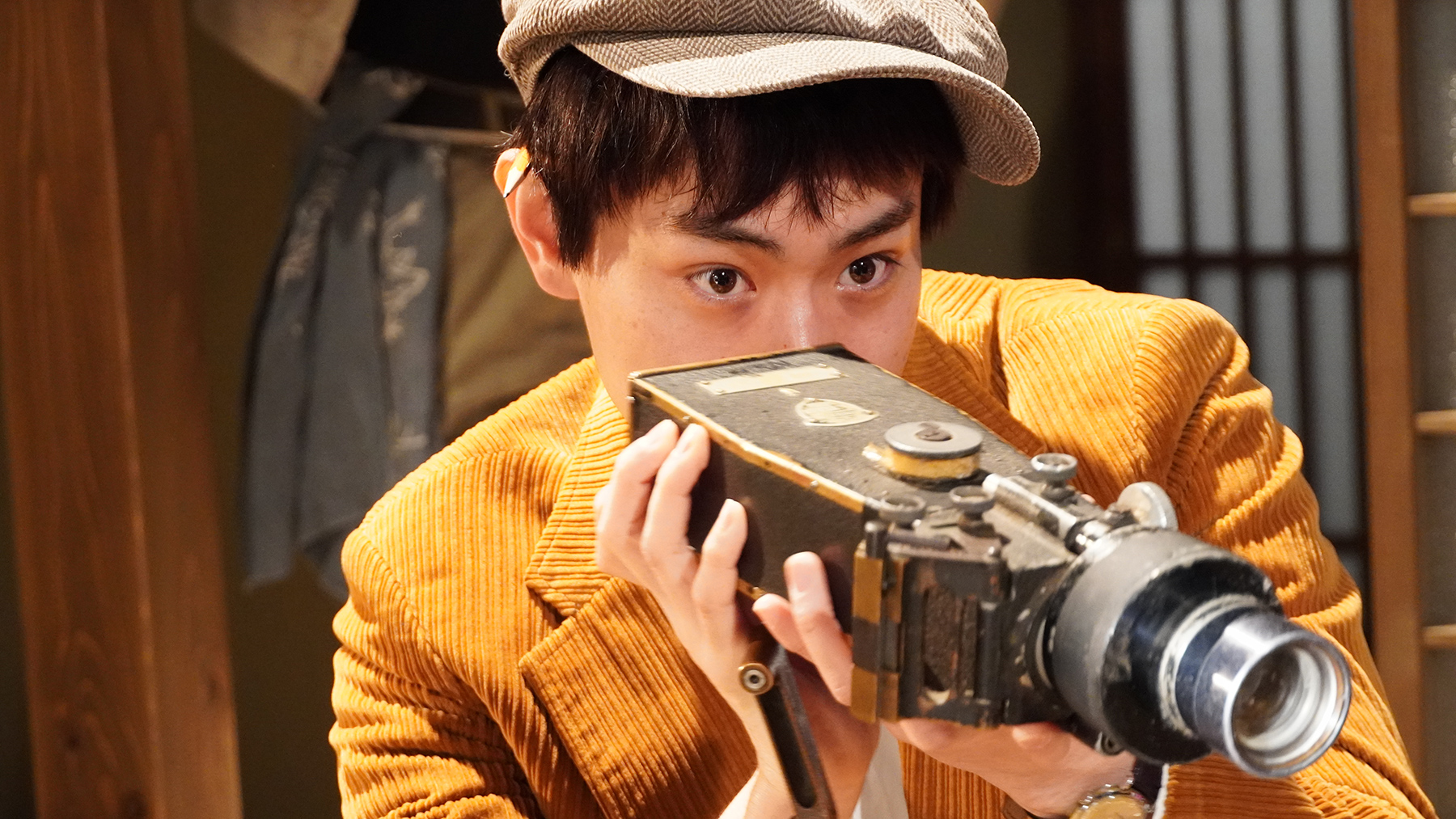 image of man holding old camera