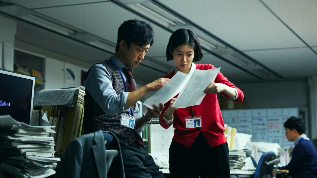 The Journalist discussing at the office