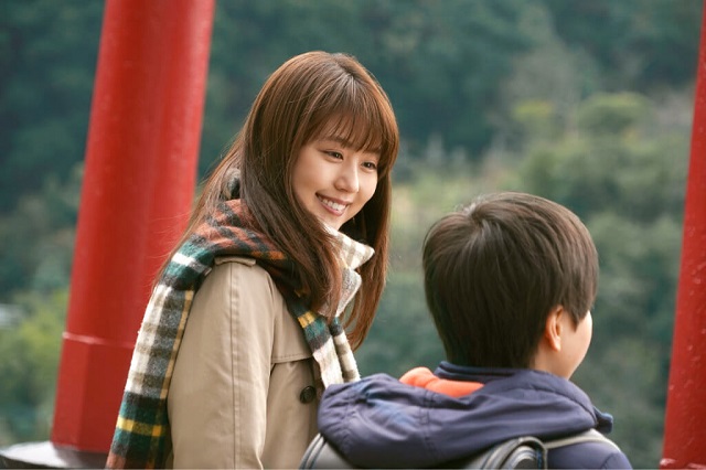 woman looking lovingly at child