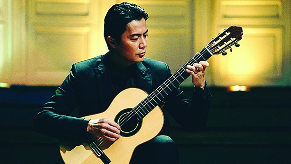 AT THE END OF THE MATINEE - playing guitar