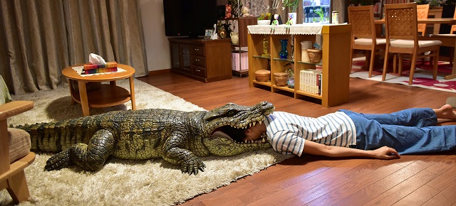 woman with head in crocodile mouth