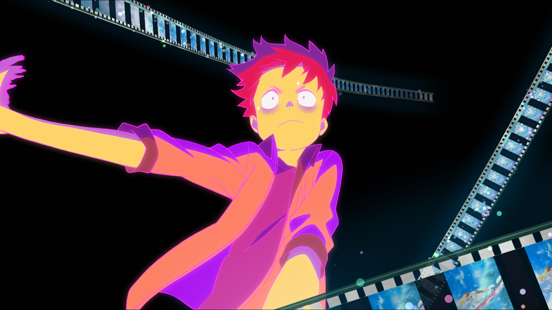 boy surrounded by film tape