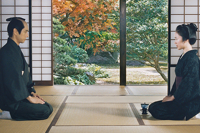 two men sitting in temple