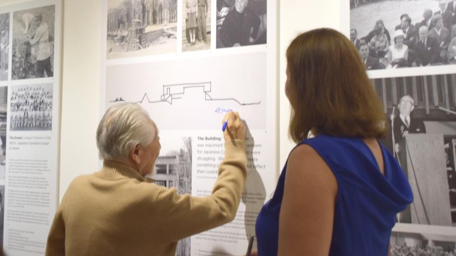 A Place of Pride Exhibit - man signing wall